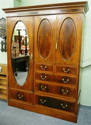 Lot 620 - An Edwardian mahogany, satinwood and tulip banded combination wardrobe