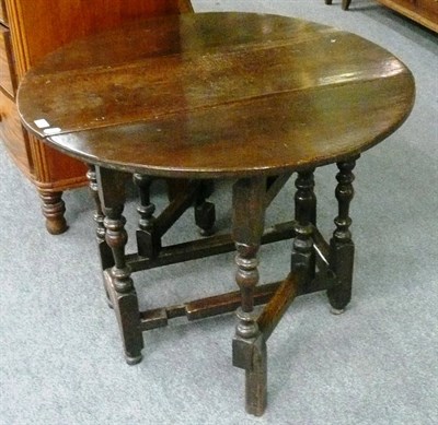 Lot 624 - An 18th century oak gate leg table (repairs)