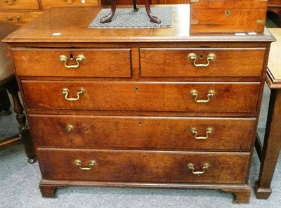 Lot 630 - A Georgian oak four height chest of drawers