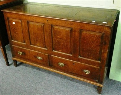 Lot 637 - A late 18th century oak panelled kist with two drawers below