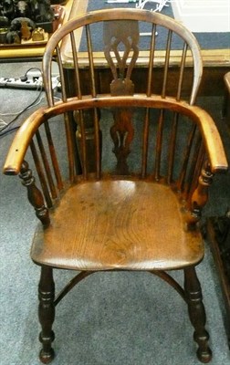 Lot 646 - 19th century yew and elm Windsor arm chair on crinoline stretcher