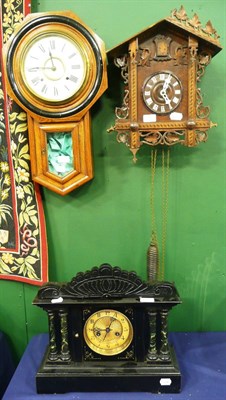 Lot 656 - An Edwardian faux marble mantel clock, cuckoo clock and an oak wall clock