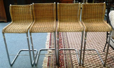 Lot 665 - Set of four wicker and chromed bar stools