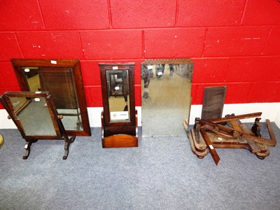 Lot 678 - An oak framed shaving mirror, an oak wall mirror, a mahogany framed toilet mirror, a...