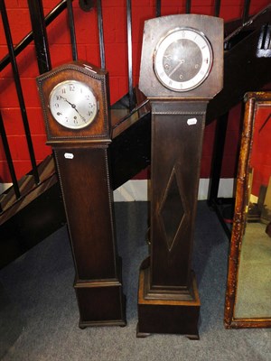 Lot 680 - Two oak cased grandmother clocks