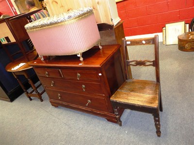 Lot 686 - A mahogany three height chest of drawers, a Lloyd Loom style Ottoman and a mahogany country chair