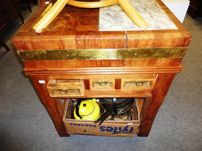 Lot 689 - A carved oak sideboard and a teak butchers block with brass mounts and a box including...