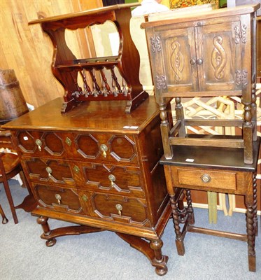 Lot 694 - A carved oak TV cabinet with panelled front, two side tables, a reproduction oak freestanding...