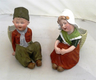Lot 23 - A pair of seated Heubach children