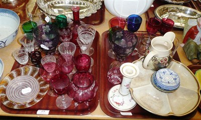 Lot 24 - A quantity of coloured glassware and pottery on two trays