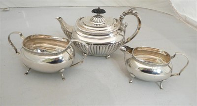 Lot 28 - A silver teapot, sugar and cream jug, 30oz approximate weight