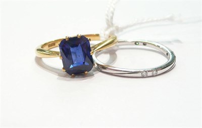 Lot 56 - A 9ct gold band ring and a blue stone ring stamped '18ct'