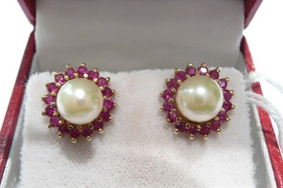 Lot 61 - A pair of cultured pearl stud earrings with a detachable ruby hoop