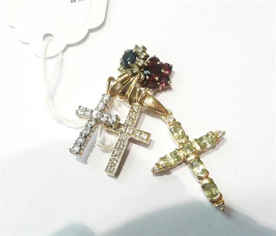 Lot 77 - A diamond set cross, a 9ct gold peridot cross, two 9ct gold cluster pendants and another cross