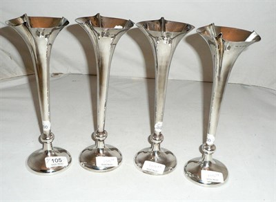 Lot 105 - Set of four silver bud vases