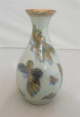 Lot 106 - A 1920s Wedgewood butterfly lustre vase of pear shape, decorated with butterflies on a...