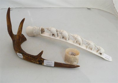 Lot 122 - A carved elephant bridge, elephant carved napkin ring and an antler cribbage board