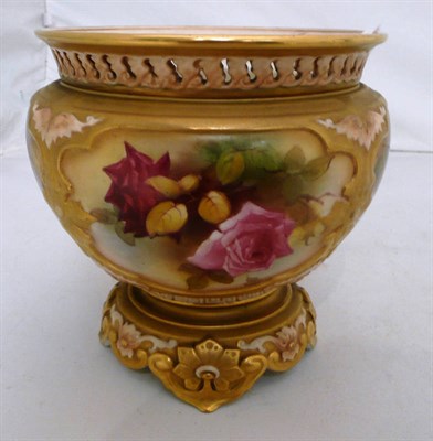 Lot 123 - A Royal Worcester rose bowl, painted with panels of pink roses within brushed gilt borders, printed