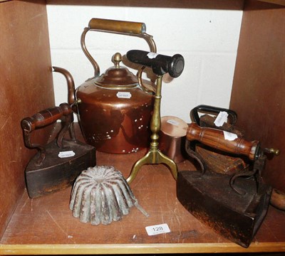 Lot 128 - Copper kettle, copper jelly mould, goffering iron, four antique irons and a trivet