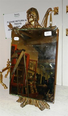 Lot 141 - A mirror on a brass figural easel frame