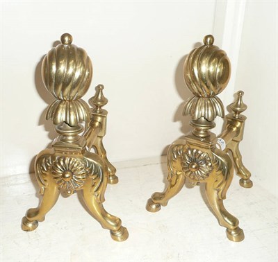 Lot 142 - A pair of brass fire dogs