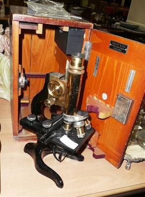 Lot 145 - A cased microscope