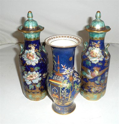 Lot 153 - A pair of Keeling Losol ware lustrous vases and covers and a Carlton ware Chinoserie vase (3)