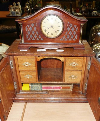 Lot 161 - A oak smokers cabinet and small mahogany mantle clock (2)