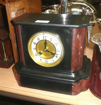 Lot 162 - A black slate striking mantel clock