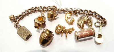 Lot 184 - A gold charm bracelet