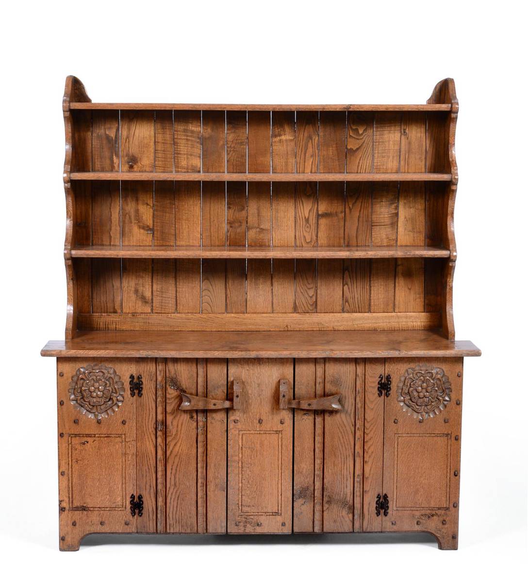 Lot 549 - A Jack Grimble of Cromer Oak Dresser, the plate rack above two cupboard doors, with exposed...