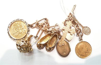 Lot 194 - A fancy link bracelet hung with seven charms including a soldered 1908 half sovereign and a...