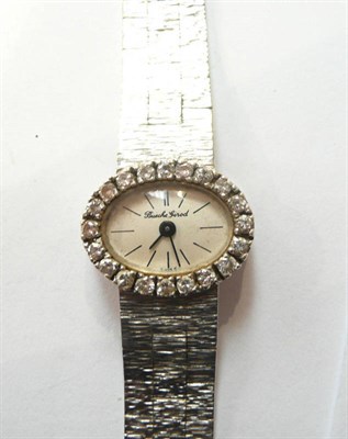 Lot 219 - A 9ct white gold lady's diamond set wristwatch, Bueche Girod