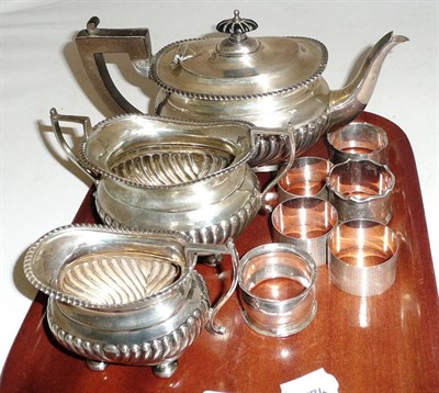 Lot 232 - A silver three piece tea service and six napkin rings