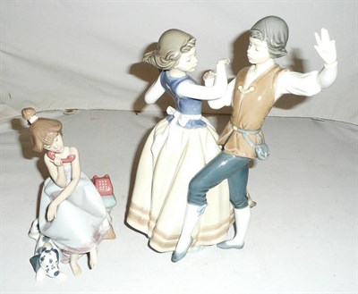 Lot 240 - Lladro figure group of two dancers and another with a lady