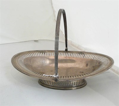 Lot 248 - A pierced silver basket with swing handle