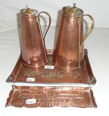 Lot 251 - Two Benson copper jugs and two Arts and Crafts copper trays