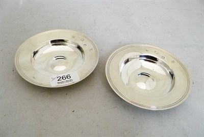 Lot 266 - A pair of small silver circular dishes