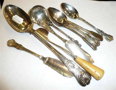 Lot 287 - Four dessert spoons, two butter knives, a cheese scoop (plate), a Kings pattern basting spoon and a