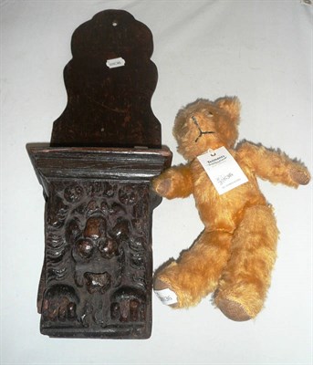 Lot 333 - Carved oak wall bracket and small yellow plush teddy bear (2)