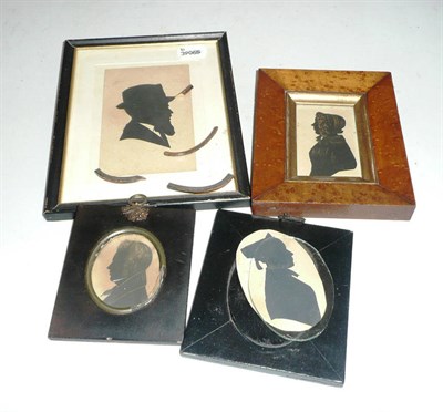 Lot 345 - A 19th century silhouette of a lady in a maple frame and three other silhouettes