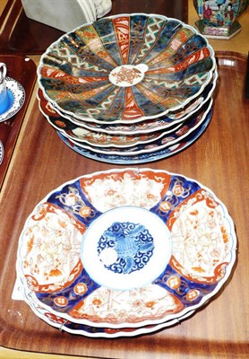 Lot 346 - A pair of ovoid Imari dishes, five fluted Imari plates