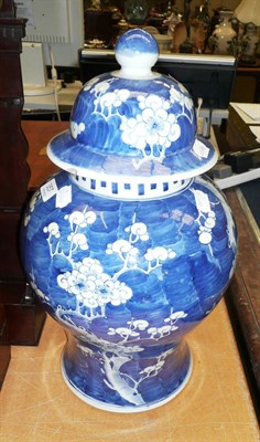 Lot 357 - A Chinese blue and white prunus decorated vase and cover