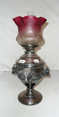 Lot 369 - An electroplated oil lamp decorated with four cattle heads and inscribed 'Thorleys Special...