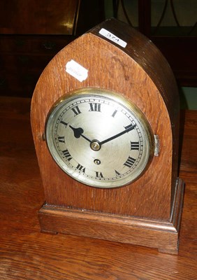 Lot 374 - Oak cased lancet shaped mantle clock