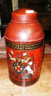 Lot 379 - A red painted tinplate tea canister, transfer decorated with a coat of arms