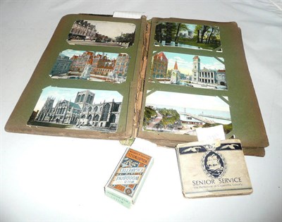 Lot 399 - An album of mixed postcards and two packets of cigarette cards