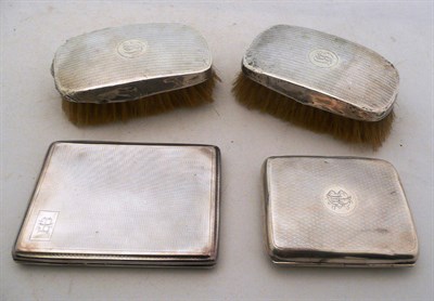 Lot 411 - Two silver cigarette cases and two silver mounted brushes