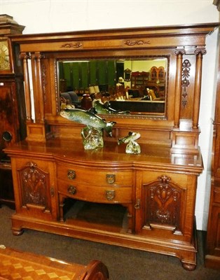 Lot 507 - A late Victorian light oak sideboard with carved mirrored back, flanked by double Corinthian column