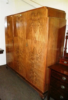 Lot 513 - A 1930's walnut triple wardrobe